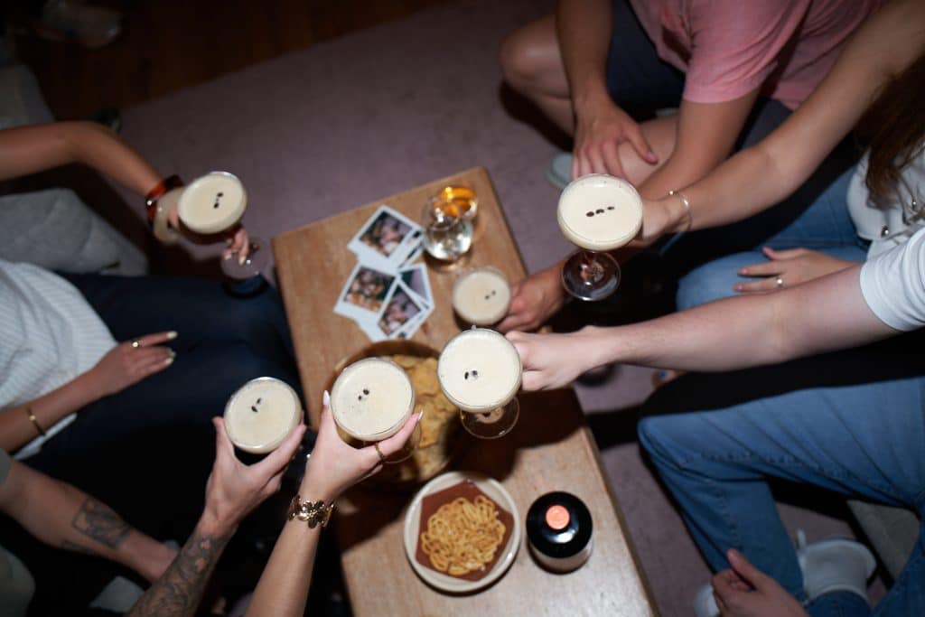 people toasting with Conker Espresso Martinis